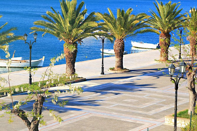 Athens: Ancient Corinth & Nafplio Full Day Trip with Swim - Arvanitia Beach swim time in summer, with forts overhead and rocky footing