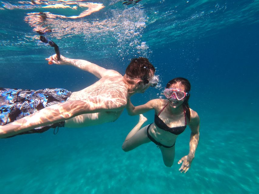 Athens: Catamaran Cruise with Fresh Lunch and Wine - Vouliagmeni Bay snorkeling and the more social side of the coast
