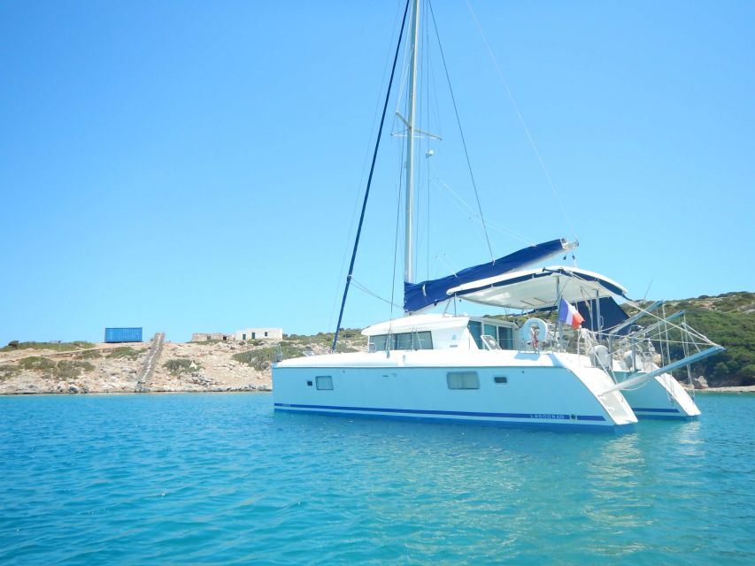 Athens: Catamaran Cruise with Fresh Lunch and Wine - Wine, fruits, and a calm sail back toward Alimos and Pier 6