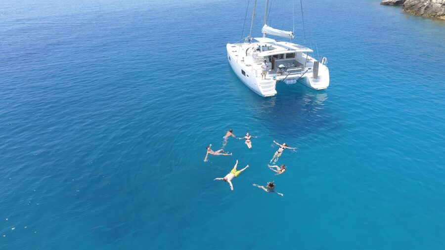 Athens: Riviera Catamaran Cruise with Meal and Drinks - Swim stop #1 near Voula: easy water time and good bay conditions