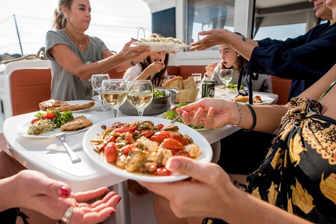 Athens Semi Private Sunset Catamaran Cruise with meal & drinks - Lunch onboard and local drinks: what you should expect