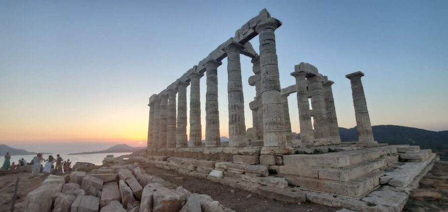 Athens: Temple of Poseidon and Cape Sounion Sunset Tour - Entering Cape Sounion at sunset, where Poseidon owns the view