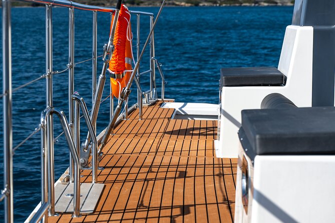 Comfort Max Catamaran Caldera Cruise with BBQ and Drinks - Snorkeling time: warm water, rocks, and what you can expect