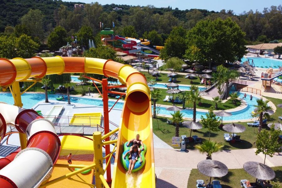 Corfu: Aqualand Water Park 1- or 2-Day Entry Tickets - The green park setup: sun beds, umbrellas, and real shade