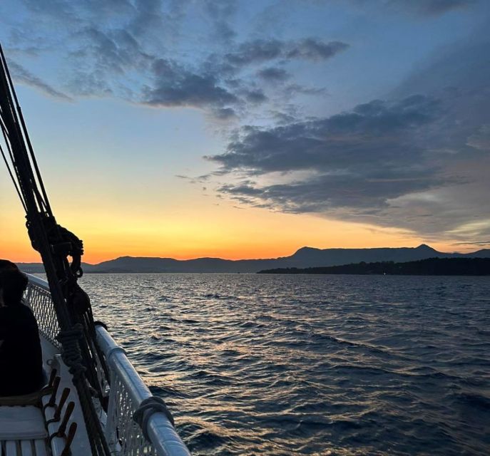 Corfu: Sunset Cruise on Classic Boat with Cocktails & Snacks - The crew makes it, especially when they walk and point