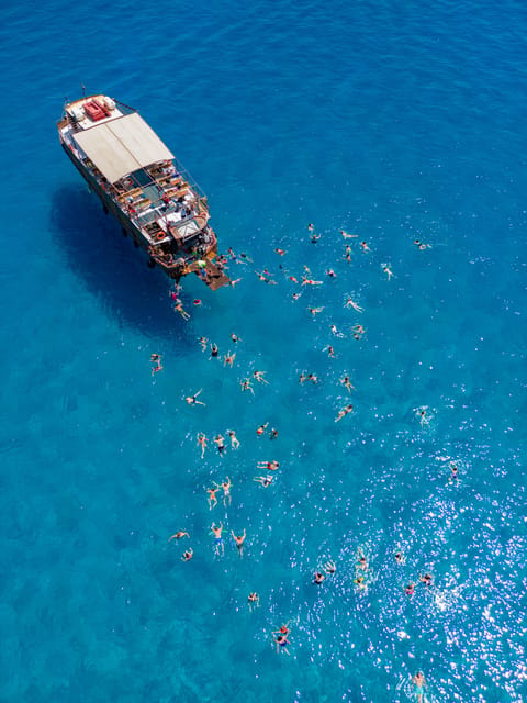 Faliraki : Transfer & Cruise to Lindos with 3 Swimming Stops - From your hotel to Kolympia Harbor at 9:00, what the logistics feel like
