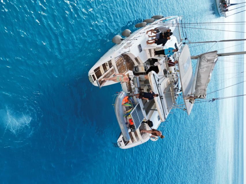 From Adamas: Milos and Poliegos Catamaran Cruise with Lunch - A Smooth 9.5 Hours That Still Packs Real Variety