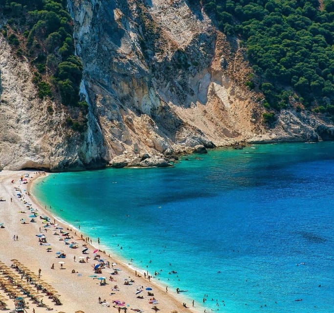From Argostoli: Melissani Lake and Myrtos Beach Tour - Melissani Lake rowboat time, where cave light turns the water magical
