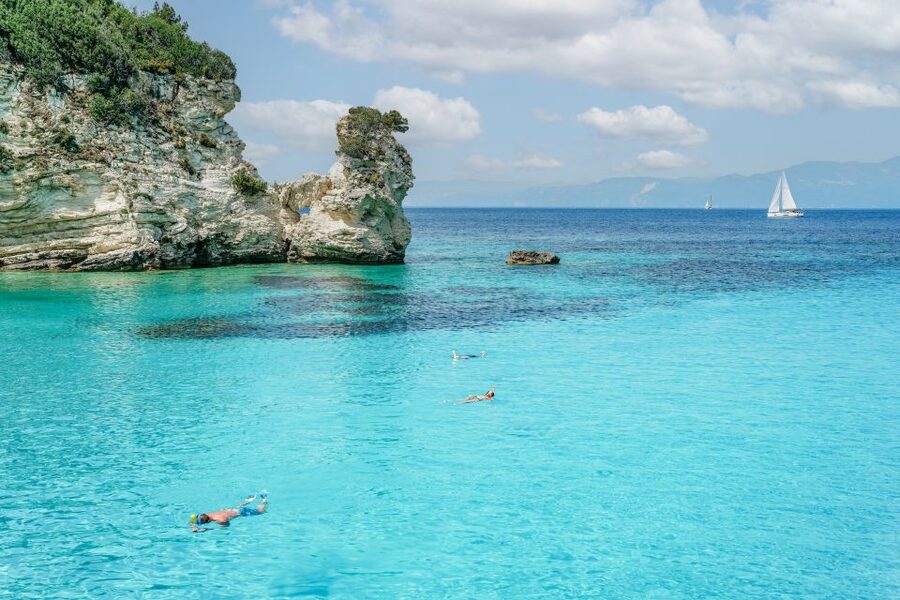 From Corfu Island: Antipaxos & Paxos Blue Caves Boat Cruise - Antipaxos swim stop at Mesovrika or Voutoumi