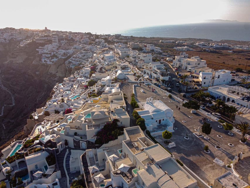 From Fira: Santorini Highlights Minibus Tour with Oia Sunset - Firostefani blue domes: the iconic church look plus walking time