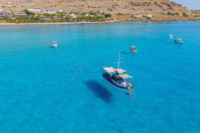 Full Day Tour 3 Swimming Stops & Lunch Stop - Getting aboard with Captain Vasilis Boat Tour, with the basics covered