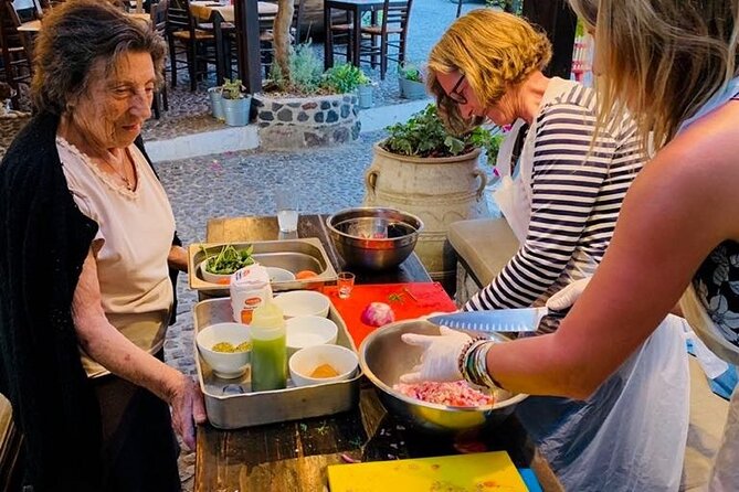 Greek Cuisine Cooking Class in Santorini with Recipes and Wine - Starter round: tzatziki, Greek salad, and tomato fritters