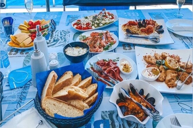 Half-Day Exclusive Catamaran Cruise in Santorini with Meal and Open Bar - Food and open bar: what’s included and how it feels in real life