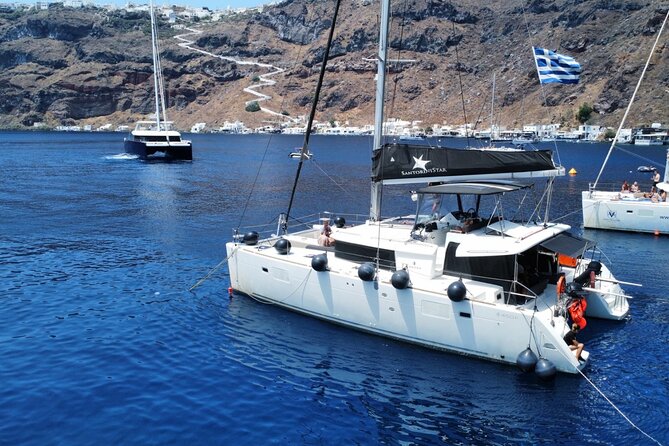 Half Day Premium Catamaran Cruise in Santorini including Oia - Meet the boat and crew vibe on a premium catamaran