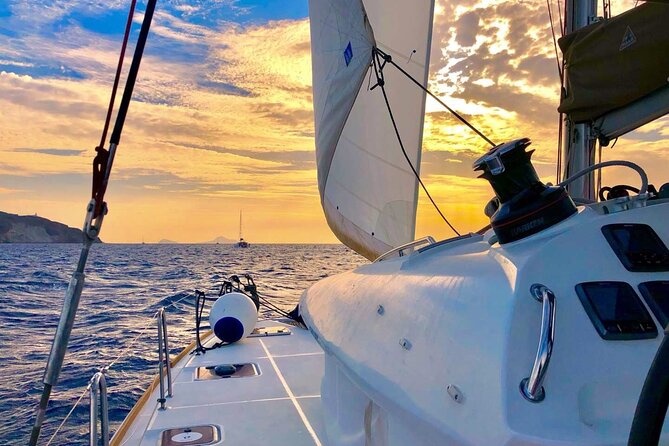 Half Day Premium Catamaran Cruise in Santorini including Oia - Stop 1: Red Beach for color, quick swim time, and easy waters