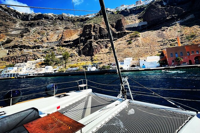 Half Day Premium Catamaran Cruise in Santorini including Oia - Stop 2: Santorini Volcano hot springs, where warm water does the job