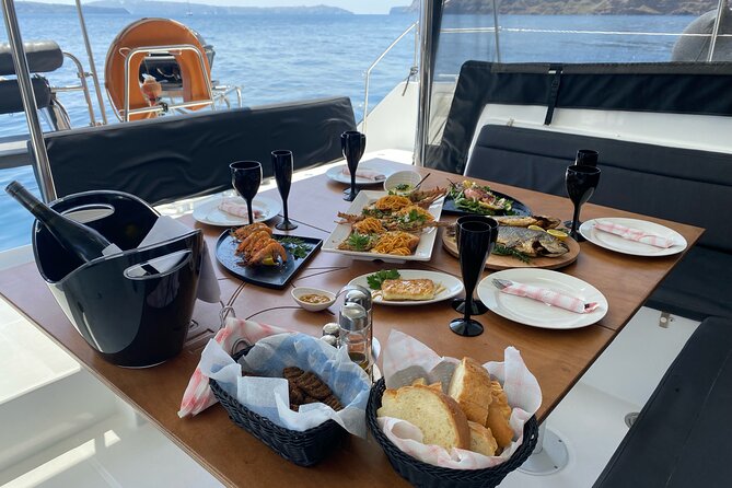 Half Day Premium Catamaran Cruise in Santorini including Oia - The in-between sailing moment: limestone formations and clear water
