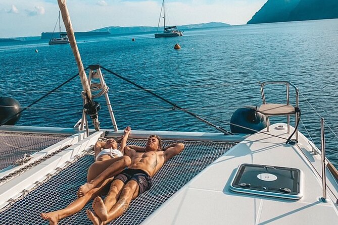 Half Day Premium Catamaran Cruise in Santorini including Oia - Oia port and the Venetian lighthouse: the sunset-facing finale