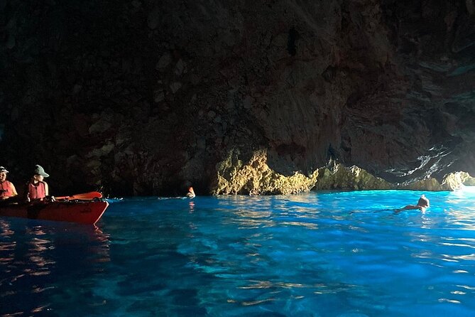Kayak Trip to Hidden blue Cave, with lunch & fruits. - Entering the Blue Cave with the hidden entrance