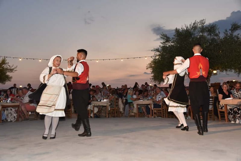 Kos: Greek Dinner with Music, Dancing, and Unlimited Wine - A full Greek menu on a clock: meze starters to wood-oven piglet