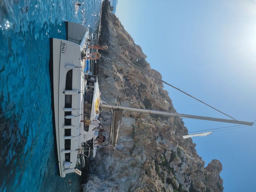 Milos: Full-Day Catamaran Cruise with Food and Open Bar - Tsigrado Photo Stop: Quick Views, Then Back to Swimming