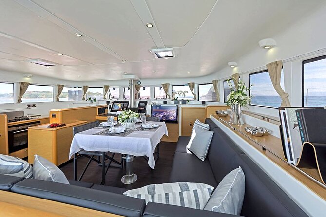 Mykonos Catamaran Premium Day-Sunset Tours 8-flavor Meal & Drinks - Delos from offshore: a quick UNESCO moment without the full land-tour time