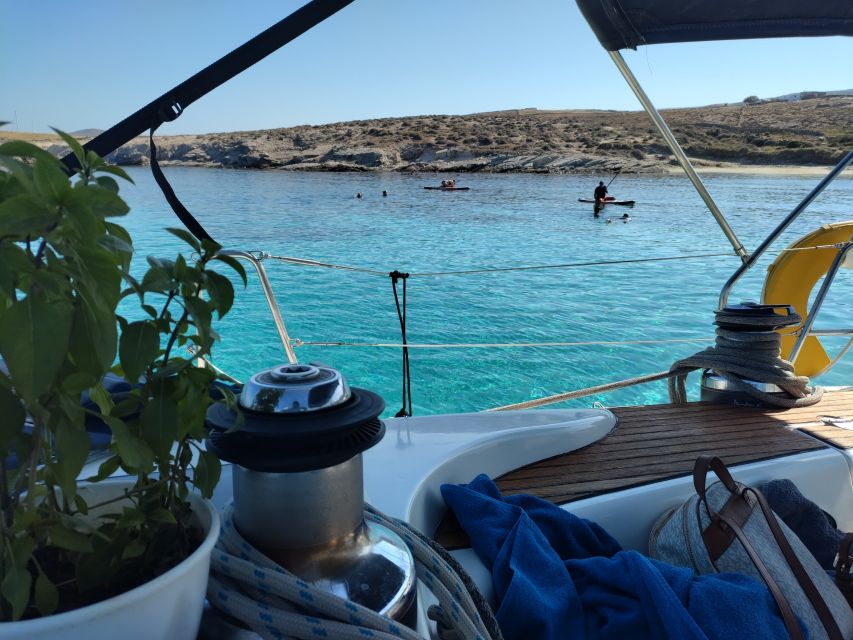 Mykonos: Delos and Rhenia Cruise with Swim and Greek Meal - Greek lunch onboard, plus wine with an at-sea appetite