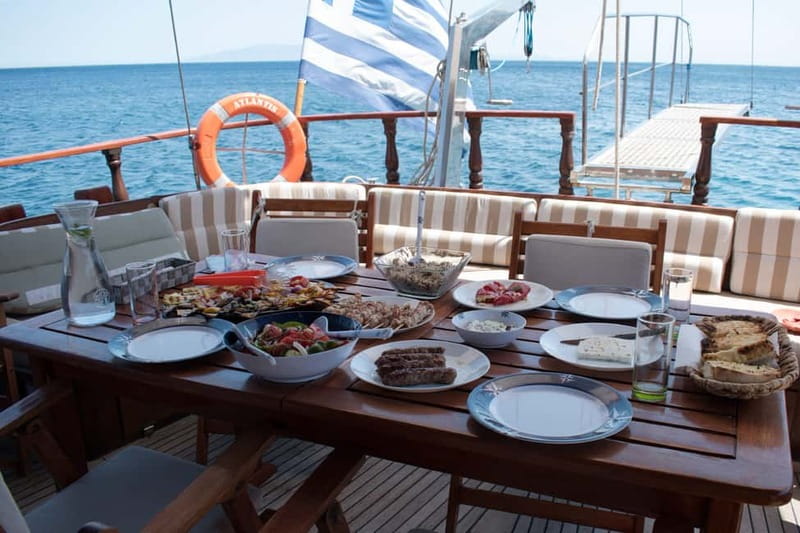 Mykonos: Delos and Rhenia Islands Cruise with BBQ Meal - Snorkel time around Delos: clear water with gear already covered
