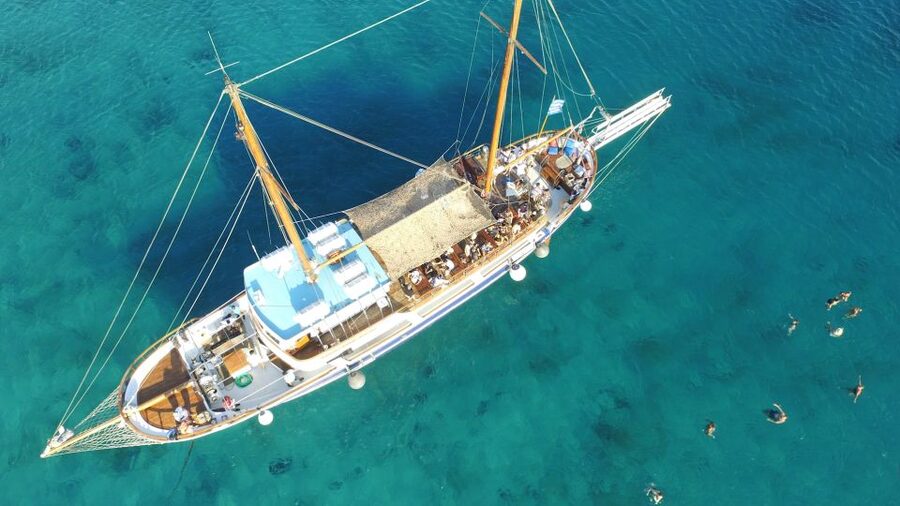 Mykonos: Sunset Party Boat Cruise with 1 Drink - DJ, Dancing, and Greek Dance on Board