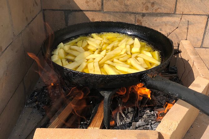 Naxos Perivoli Farm Experience & Wood-fire Cooking Class - The feast: cheeses, wine, and a very food-heavy ending