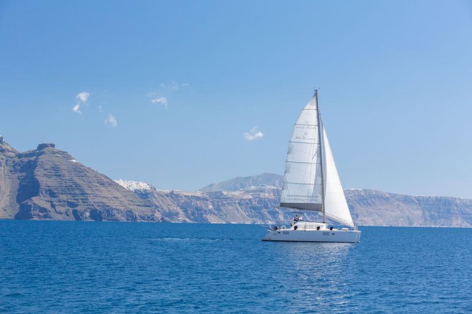Premium Small-Group Catamaran Cruise with BBQ, Open Bar, Transfer - Palea Kameni hot springs: warm water, a workout, and other boats nearby
