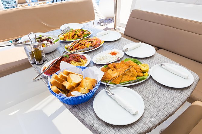 Premium Small-Group Catamaran Cruise with BBQ, Open Bar, Transfer - Nea Kameni and the volcano story: photos plus context at sea level