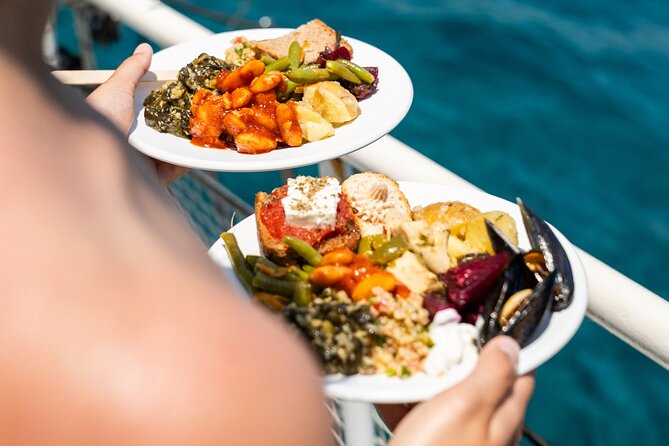 Rhodes Bay to Bay Swim Cruise-Greek Buffet w/wine included - Ladiko Bay pass-by and Afandou Beach: oil-ship clues and cave time