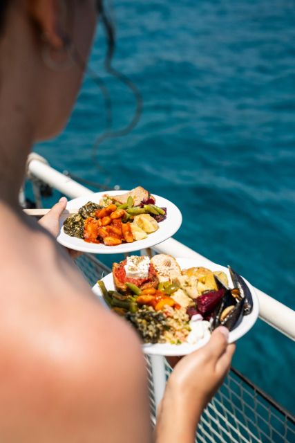 Rhodes: Bay to Bay Swim Cruise with Greek Buffet and Wine - Cruise Time: Sailing Past Rhodes Landmarks Before You Hit the Water