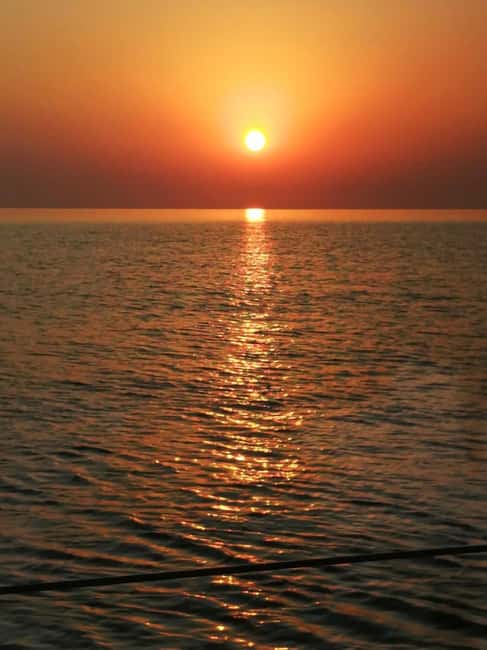 Rhodes: Sunset Catamaran Cruise with Snack, Fruits & Drinks - Mandraki Marina to the first sail, 45 minutes of getting oriented