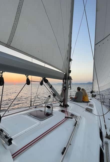 Rhodes: Sunset Catamaran Cruise with Snack, Fruits & Drinks - Sailing back past Rhodes sights, why the timing matters