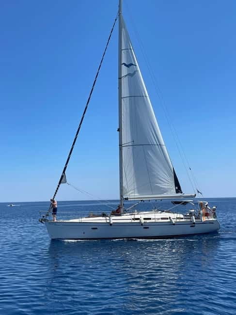 Rhodes: Sunset Catamaran Cruise with Snack, Fruits & Drinks - Elli Beach photo stop and sunset-side drinks