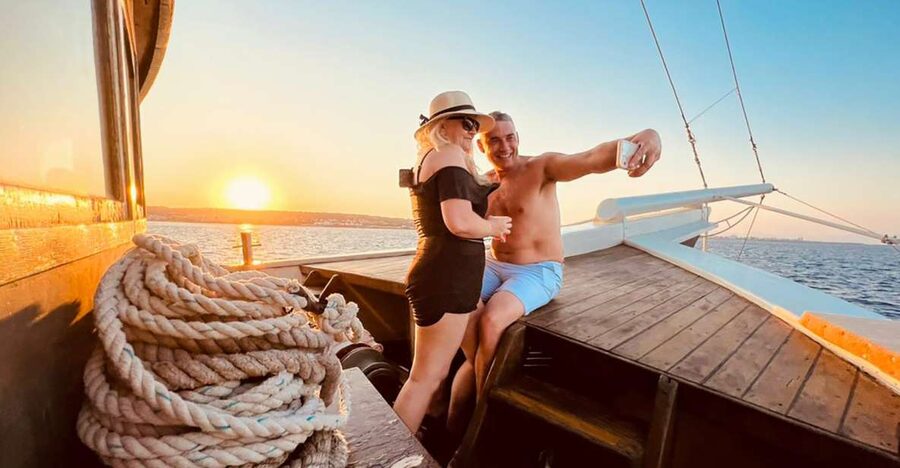 Rhodes: Sunset Cruise with Greek BBQ and Unlimited Drinks - Kallithea Springs Swim Stop: The Hour That Makes This Cruise Different