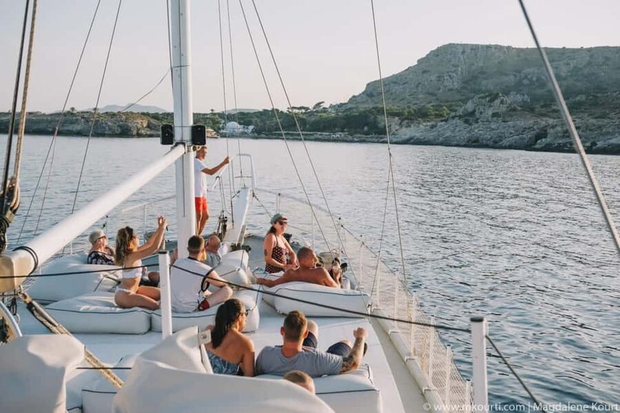 Rhodes: Sunset Cruise with Open Bar, Dinner, & Live Music - Comfort on Romantika: Seating, Sun Deck, and Staying Dry (Most of the Time)