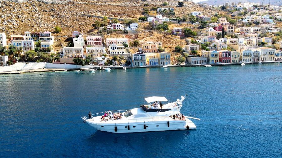Rhodes: Symi Yacht Tour with Unlimited Drinks and Transfer - Getting on board from Rhodes, coffee in hand, then straight to Symi