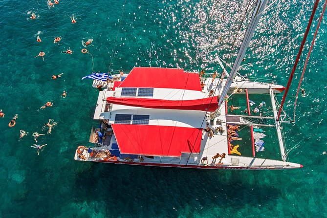 Sailing Catamaran Cruise in Santorini with BBQ, Drinks and Transfer - The volcano sailing portion: what you get before the first swim
