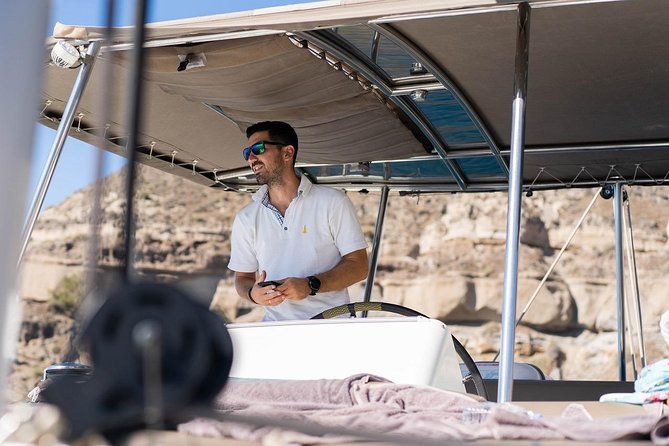 Santorini All-inclusive Catamaran Cruise with Thirassia Stop - Black Mountain, Indian Rock, and Lighthouse Views From the Water