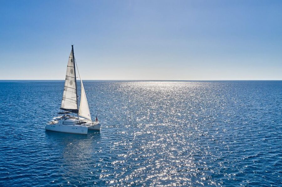 Santorini: Caldera Classic Catamaran Cruise w/ Meal & Drinks - Nea Kameni volcano snorkeling: sulfuric water at the heart of the story