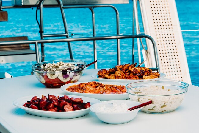 Santorini Caldera Gold Day Cruise with BBQ on board and Open Bar - Red Beach and White Beach: Swim Stops That Feel Like a Secret Deal