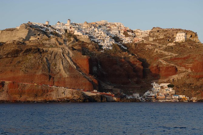 Santorini Caldera Sunset Sailing Cruise with Dinner and Wine - Stop 4, sunset near Oia, your front-row sea-level view