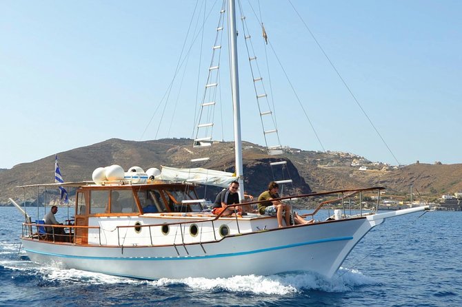 Santorini Caldera Sunset Traditional Cruise with Meal and Drinks - Sailing around the volcano area, plus rock formations and sea views