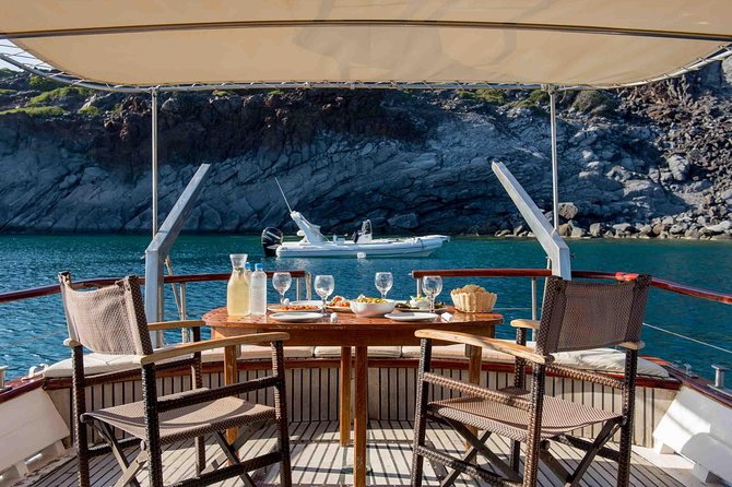 Santorini Caldera Sunset Traditional Cruise with Meal and Drinks - Thirassia swim and onboard lunch: your Greek-food reset