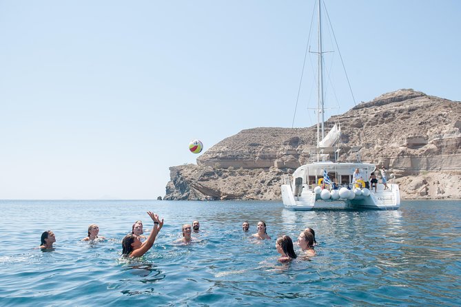 Santorini Catamaran Cruise with Fresh Meal and Open Bar - White Beach Time: Crystal Water and Minimal Crowd Feel