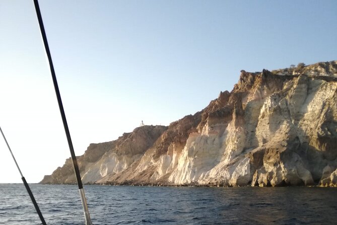 Santorini Catamaran Cruise with Fresh Meal and Open Bar - Cruise-By Landmarks Near Akrotiri: The Venetian Lighthouse