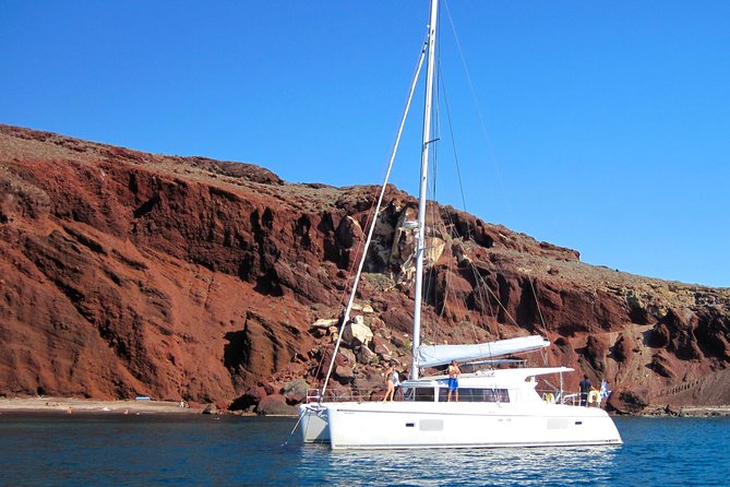 Santorini Catamaran Cruise with Fresh Meal and Open Bar - Mesa Pigadia Area: Rocky Views and a Brief Pause